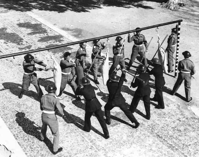 Trainees at the Police Training College in Busetta, Tripoli, practice their riot drill, 1952. (Photo by Horace Abrahams/Keystone Features)