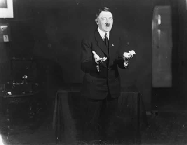 1925: Hitler posing to a recording of one of his speeches after his release from Landsberg Prison. (Photo by Heinrich Hoffmann/Keystone Features)