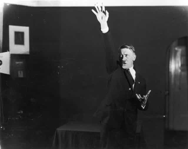 Hitler posing to a recording of one of his speeches after his release from Landsberg Prison. (Photo by Heinrich Hoffmann)