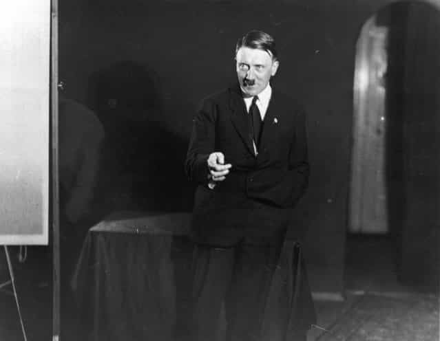 1925: Hitler posing to a recording of one of his speeches after his release from Landsberg Prison. (Photo by Heinrich Hoffmann/Keystone Features)