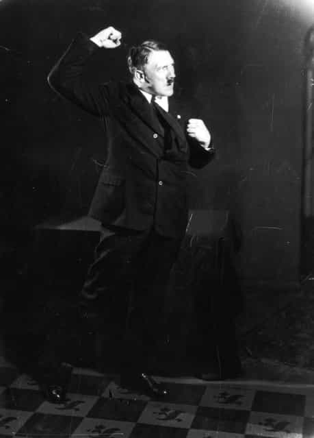 Hitler posing to a recording of one of his speeches after his release from Landsberg Prison. (Photo by Heinrich Hoffmann)