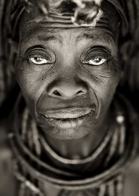 [Old Himba woman face – Angola. Old Himba woman in Angola, not the kind of ones you see in Namibia going to supermarket, and buying beers, but living in remote place, in south Angola, far from modern world, keeping their traditions strongly]. (Eric Lafforgue)