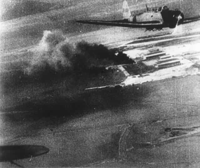 7th December 1941: A picture taken from a Japanese bomber showing another Japanese plane and plumes of black smoke on the ground during the attack on Pearl Harbour (Pearl Harbor). (Photo by Keystone/Getty Images)