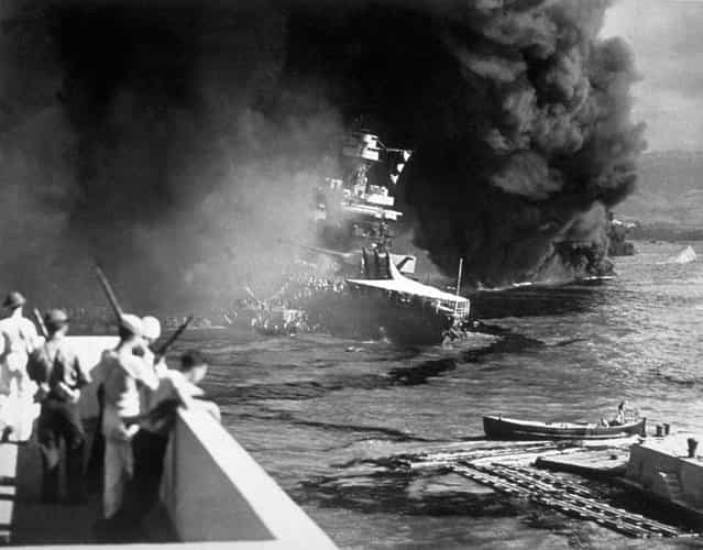 7th December 1941: The USS California on fire in Pearl Harbour (Pearl Harbor) after the Japanese attack. (Photo by Fox Photos/Getty Images)