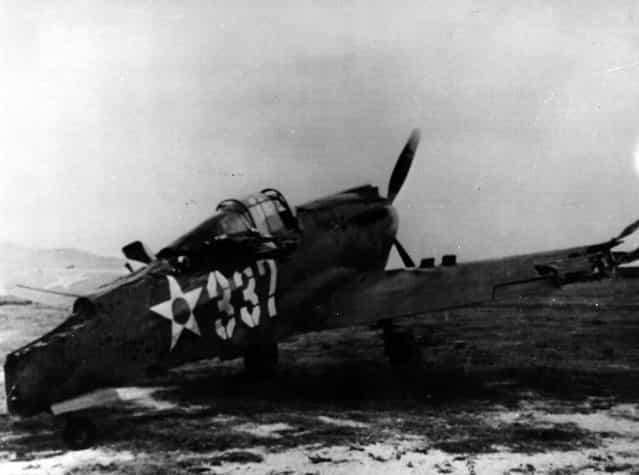 7th December 1941: Following the surprise attack by the Japanese on Pearl Harbour (Pearl Harbor) this US Army P40 pursuit plane was machine gunned on the ground at Bellows Field by the enemy. (Photo by Keystone/Getty Images)