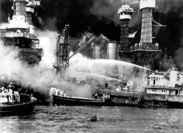 The battleship USS West Virginia is seen afire after the Japanese surprise attack on Pearl Harbor. (Photo by Associated Press)