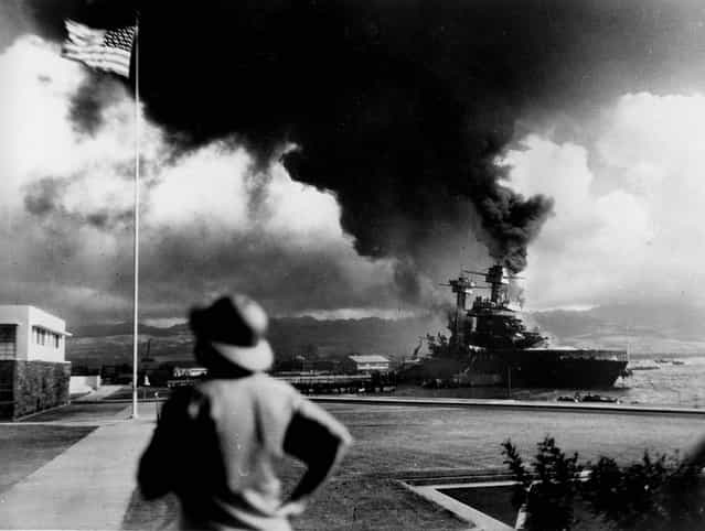 American ships burn during the Japanese attack on Pearl Harbor. (Photo by Associated Press)
