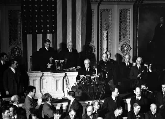 Declaring Japan guilty of a dastardly unprovoked attack, President Franklin D. Roosevelt asked Congress to declare war, December 8, 1941. Listening are Vice President Henry Wallace (left) and House Speaker Sam Rayburn. (Photo by Associated Press)