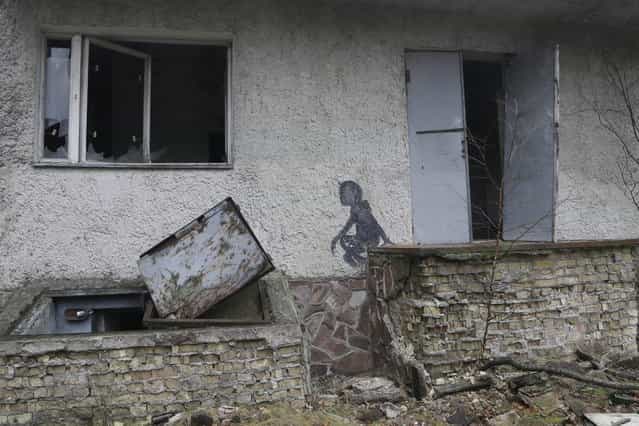 A view of empty houses in the deserted town of Pripyat near the closed Chernobyl nuclear power plant Ukraine, November 27, 2012. (Photo by Efrem Lukatsky/AP Photo)