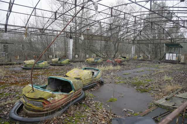 A playground in the deserted town of Pripyat, Ukraine, some 3 kilometers (1.86 miles) from the Chernobyl nuclear power plant Ukraine, November 27, 2012. (Photo by Efrem Lukatsky/AP Photo)