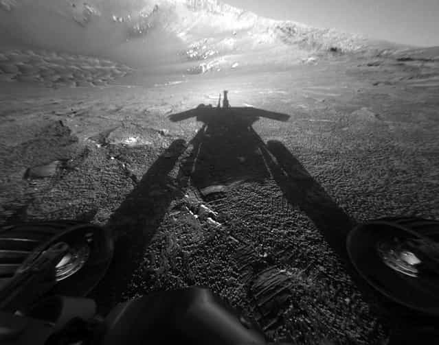 A shadow cast by NASA's Mars Rover Opportunity stretches across the Martian surface in this image taken on July 26, 2004. (Photo by AP Photo/ NASA, JPL/The Atlantic)
