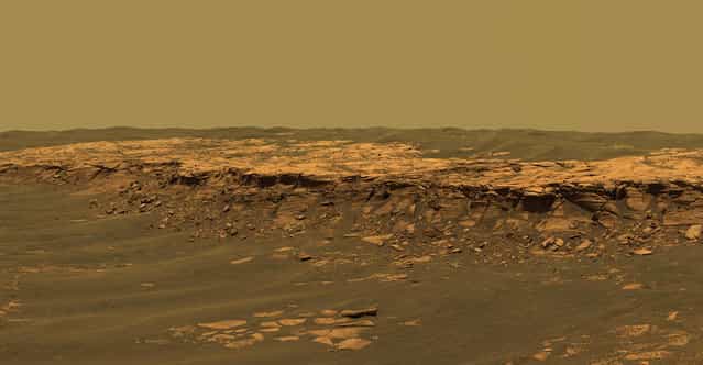 The panoramic camera aboard Opportunity acquired this panorama of the [Payson] outcrop on the western edge of Erebus Crater during Opportunity's sol 744 (February 26, 2006). From this vicinity at the northern end of the outcrop, layered rocks are observed in the crater wall, which is about 1 meters (3.3 feet) thick. The view also shows rocks disrupted by the crater-forming impact event and subjected to erosion over time. (Photo by NASA/JPL-Caltech/USGS/Cornell University/The Atlantic)