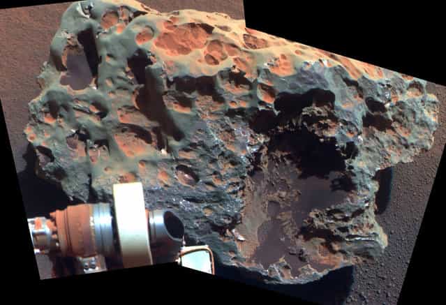 A view of a rock called [Block Island], the largest meteorite yet found on Mars, comes from the panoramic camera on Opportunity. Analysis of Block Island's composition using the rover's alpha particle X-ray spectrometer confirmed that it is rich in iron and nickel. The rock is about 60 centimeters (2 feet) across. (Photo by AP Photo/NASA/JPL-Caltech/Cornell University/The Atlantic)