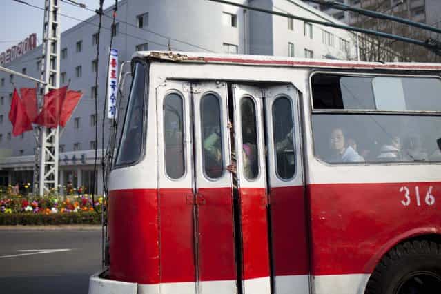 In this April 15, 2011 photo, a city tram carries passengers in Pyongyang, North Korea. (Photo by David Guttenfelder/AP Photo)