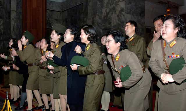 North Koreans weep for their deceased leader Kim Jong Il in Pyongyang, on December 23, 2011. (Photo by Reuters/KCNA)