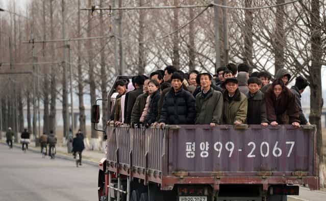 North Koreans commute to work in Pyongyang on April 8, 2012. North Korea is counting down to the 100th anniversary of its founder's birth on April 15 with top-level meetings and a controversial rocket launch scheduled in coming days to bolster his grandson's credentials. (Photo by Pedro Ugarte/AFP Photo)