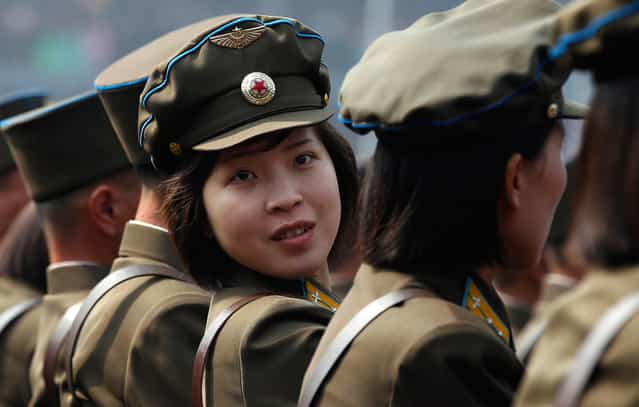 A soldier looks back during a ceremony in Pyongyang, on April 14, 2012, one day before the centenary of the birth of North Korea founder Kim Il-sung. (Photo by Bobby Yip/Reuters)