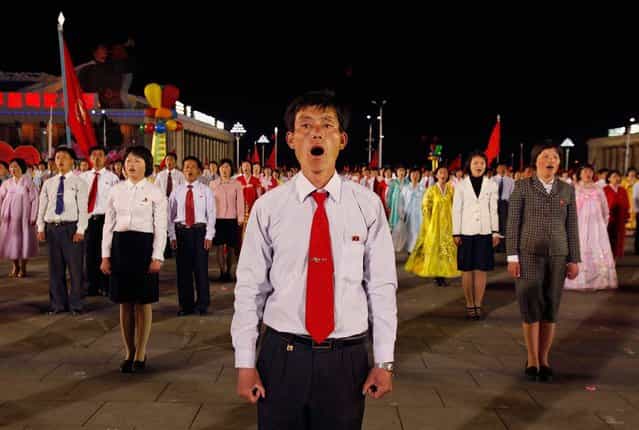 Dancers stand in formation and sing in a gala show in Pyongyang, on April 16, 2012. The performance was part of the celebration on the centenary of the birth of Kim Il Sung. (Photo by Bobby Yip/Reuters)