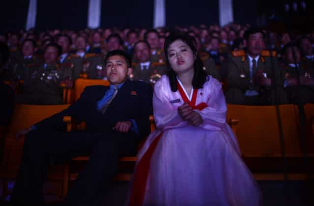 North Koreans watch a theater performance during celebrations to mark the 100th birth anniversary of Kim Il Sung, in Pyongyang, on April 16, 2012. (Photo by Pedro Ugarte/AFP Photo)