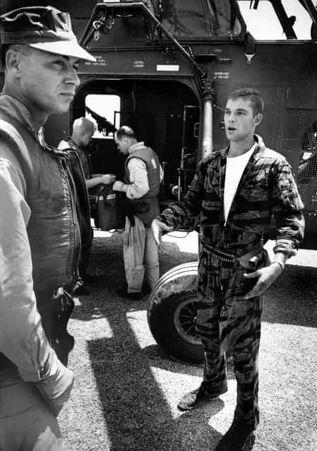 Farley talks to his own pilot, Captain Vogel, about the pilot who had to be left behind in YP3. [If we had stayed another 10 seconds under those V.C. machine guns], Vogel said, [you or us would never have got out of there]. (Photo by Larry Burrows/Time & Life Pictures)