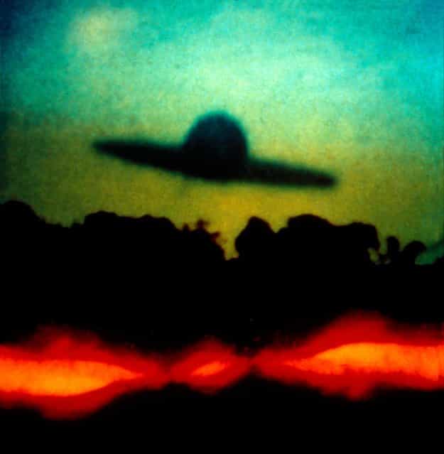[Soft Landing] by Oliver Wasow, 1987. The stock-in-trade of supermarket tabloids, images of UFOs test the relationship between photography and belief. In Soft Landing, as in his many other images of mysteriously floating disks and orbs, Wasow courts doubt by distorting found images, running them through a battery of processes, including photocopying, drawing, and superimposition. The resulting photographs play with the human propensity to invest form with meaning, offering just enough detail to spur the imagination. (Photo courtesy of The Metropolitan Museum of Art)