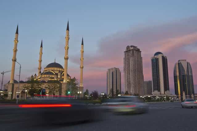 Cars drive along Akhmad Kadyrov Avenue, with the Heart of Chechnya mosque and skyscrapers in the background in the Chechen capital Grozny April 27, 2013. (Photo by Maxim Shemetov/Reuters)