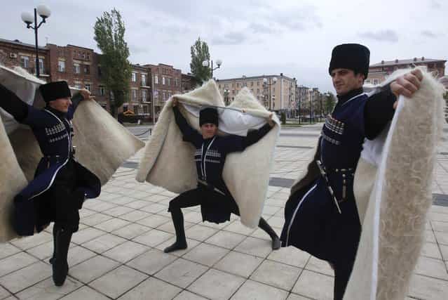 Members of a Chechen dance group pose for photographers at a government-organised event marking Chechen language day in the centre of the Chechen capital Grozny April 25, 2013. (Photo by Maxim Shemetov/Reuters)