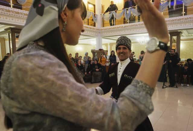 Guests dance at a wedding in the Chechen capital Grozny April 24, 2013. (Photo by Maxim Shemetov/Reuters)