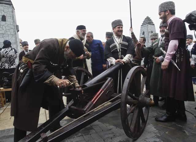 Chechen leader Ramzan Kadyrov (C) watches as men load up a cannon during a government-organised event marking Chechen language day in the centre of the Chechen capital Grozny April 25, 2013. (Photo by Maxim Shemetov/Reuters)