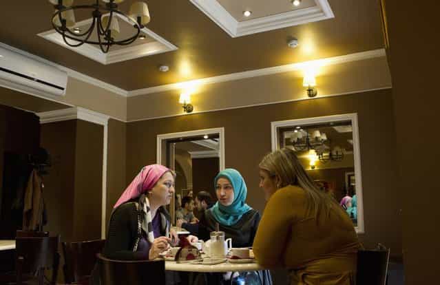 Chechen women chat in a cafe in the centre of the Chechen capital Grozny April 23, 2013. (Photo by Maxim Shemetov/Reuters)