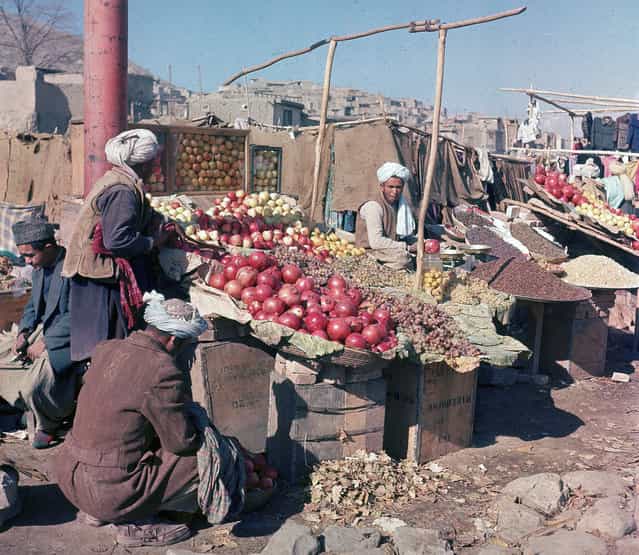 Vendors sell various fuits and nuts at an outdoor market in Kabul, in November of 1961. (Photo by Henry S. Bradsher/AP Photo via The Atlantic)