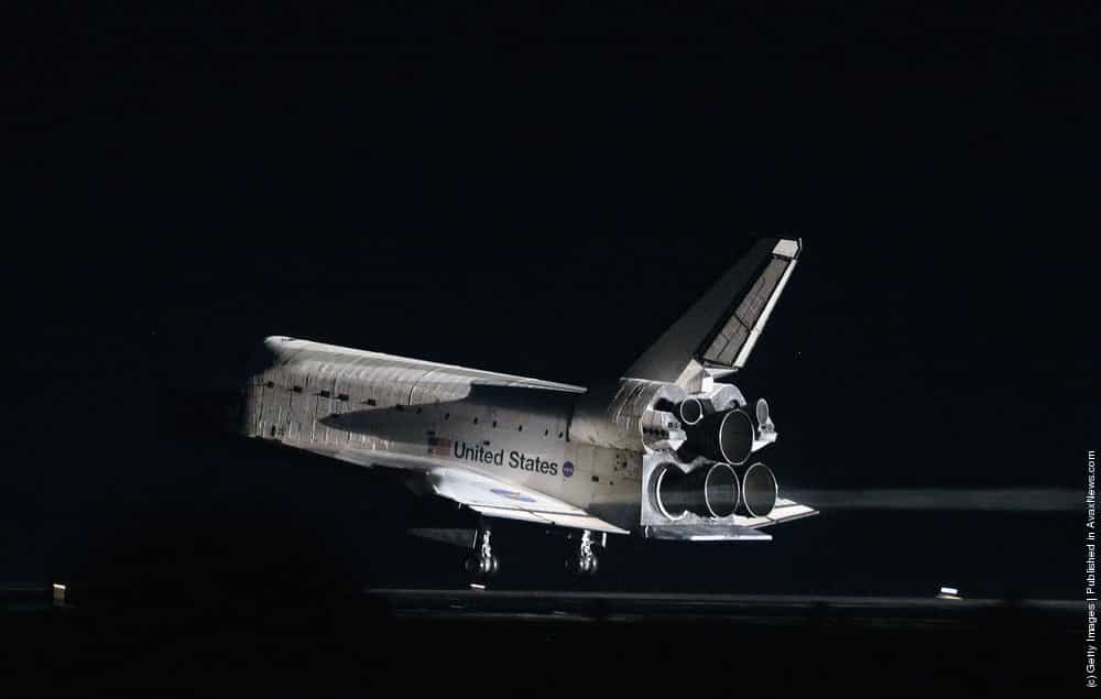 Space Shuttle Atlantis lands at the Kennedy Space Center July 21, 2011 in C...