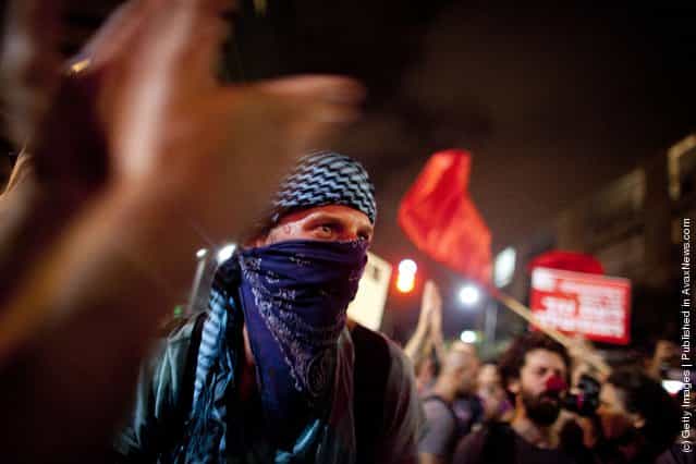 Israelis march as they protest against rising housing prices and social inequalities on July 30, 2011 in Tel Aviv, Israel