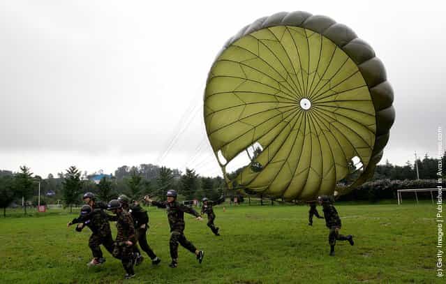 South Korean teenagers participate in a warfare exercise as part of the Special Warfare Commands training course at a military base