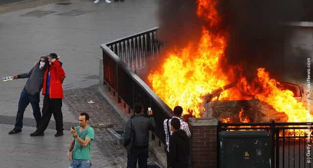 Burning car during riots in Birmingham City Centre on August 8, 2011 in Birmingham, England