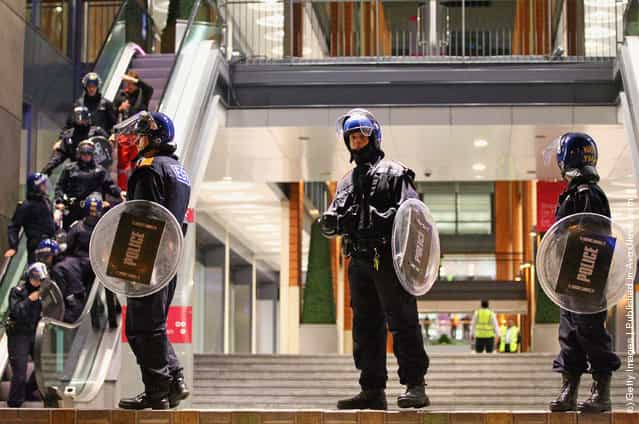 Police stand guard at the Mailbox shopping and hotel complex in Birmingham City Centre on August 8, 2011 in Birmingham, England