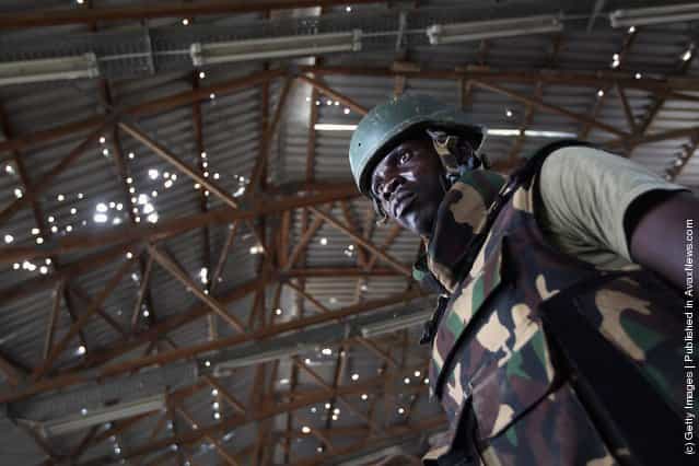 A Ugandan soldier stands in a bomb making warehouse in Mogadishu, Somalia