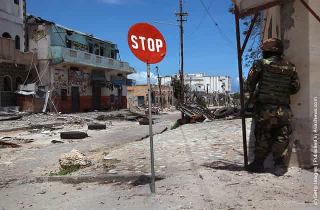 Ugandan soldier guards a street corner in the infamous Bakara market in Mogadishu, Somalia