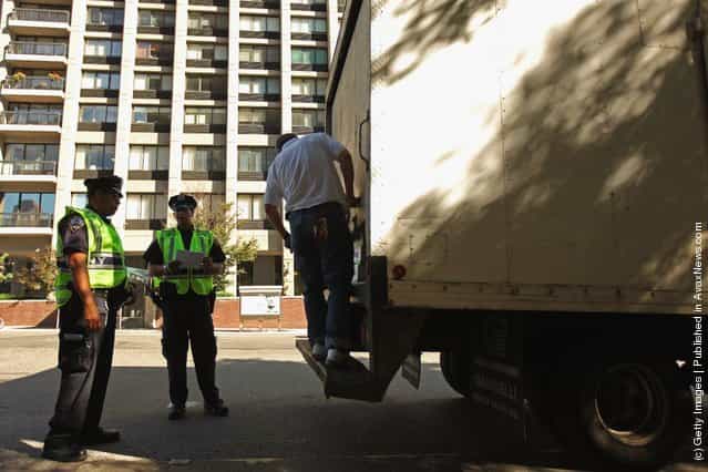 Police officers search a truck