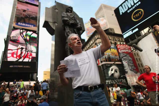 The day before the tenth anniversary of the September 11 attacks on New York and Washington, Christian preacher Terry Jones (C) lectures a crowd in Times Square