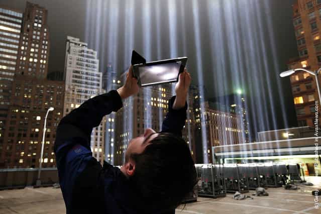 Lighting Designer Frank Hollenkamp uses his iPad to shoot video of the Tribute in Lights ahead of the tenth anniversary of the September 11 terrorist attacks
