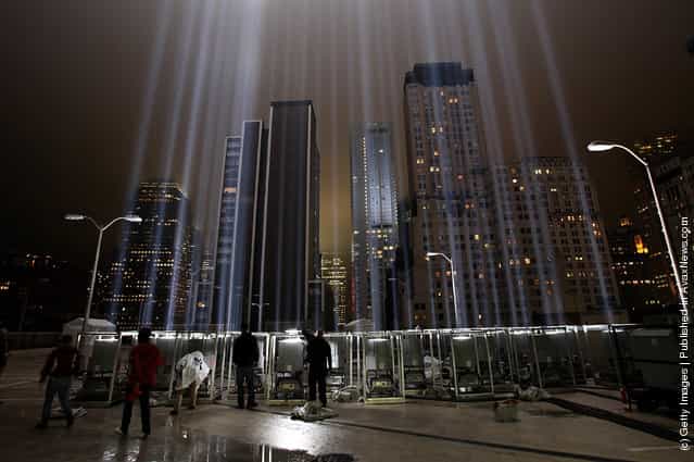Workers adjust beams of the Tribute in Lights ahead of the tenth anniversary of the September 11 terrorist attacks