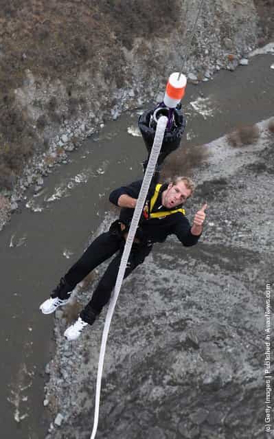 James Haskell, the England flank forward, is hoisted back up after his bungy jump at the 134 meter high Nevis Bungy jump during an England IRB Rugby World Cup 2011