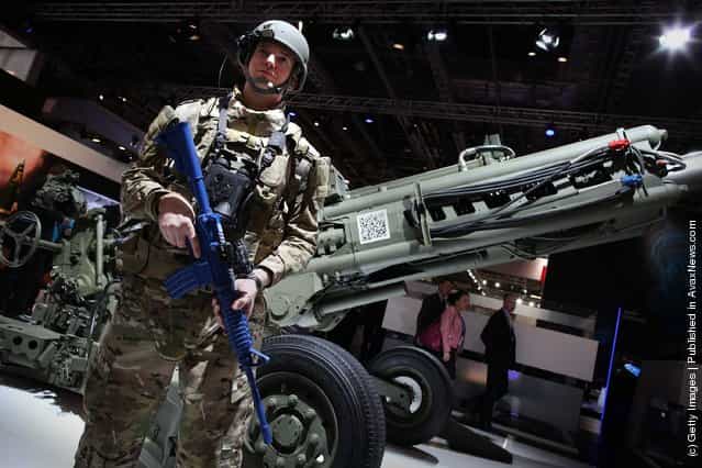 A soldier displays new technology at The Defence and Security Exhibition