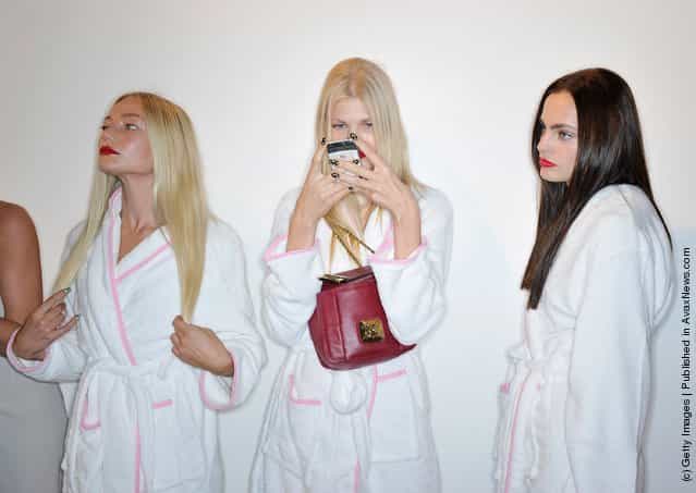 Models backstage before the PPQ show during London Fashion Week Spring/Summer 2012