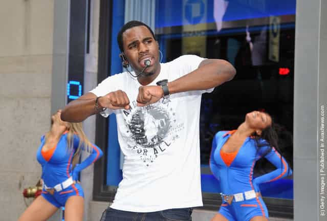 Singer Jason Derulo performs during his Flash Mob with Knicks City Dancers outside of Madison Square Garden
