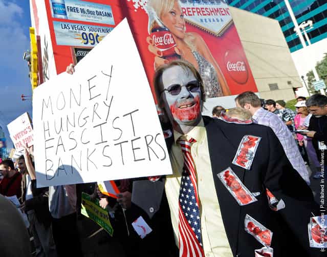 A protester affiliated with the Occupy Las Vegas movement, takes part in a march on the Las Vegas Strip