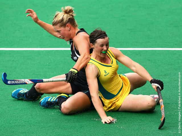Claire Messent of the Hockeyroos competes with Sophie Devine of the Blacksticks during the Oceania Cup match between New Zealand and Australia