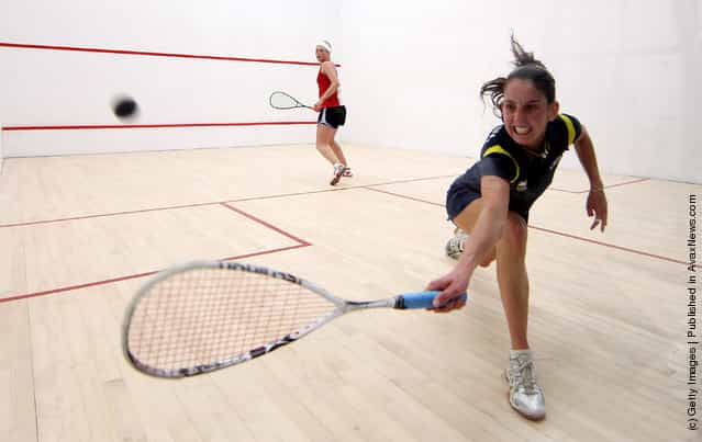 Thaisa Serafini of Brasil (R) plays a backhand during her Squash match against Lily Lorentzen of the USA during Day One of the XVI Pan American Games