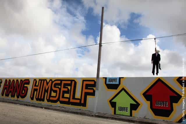 Effigy Of Wall Street Banker Hangs By Freeway In Miami
